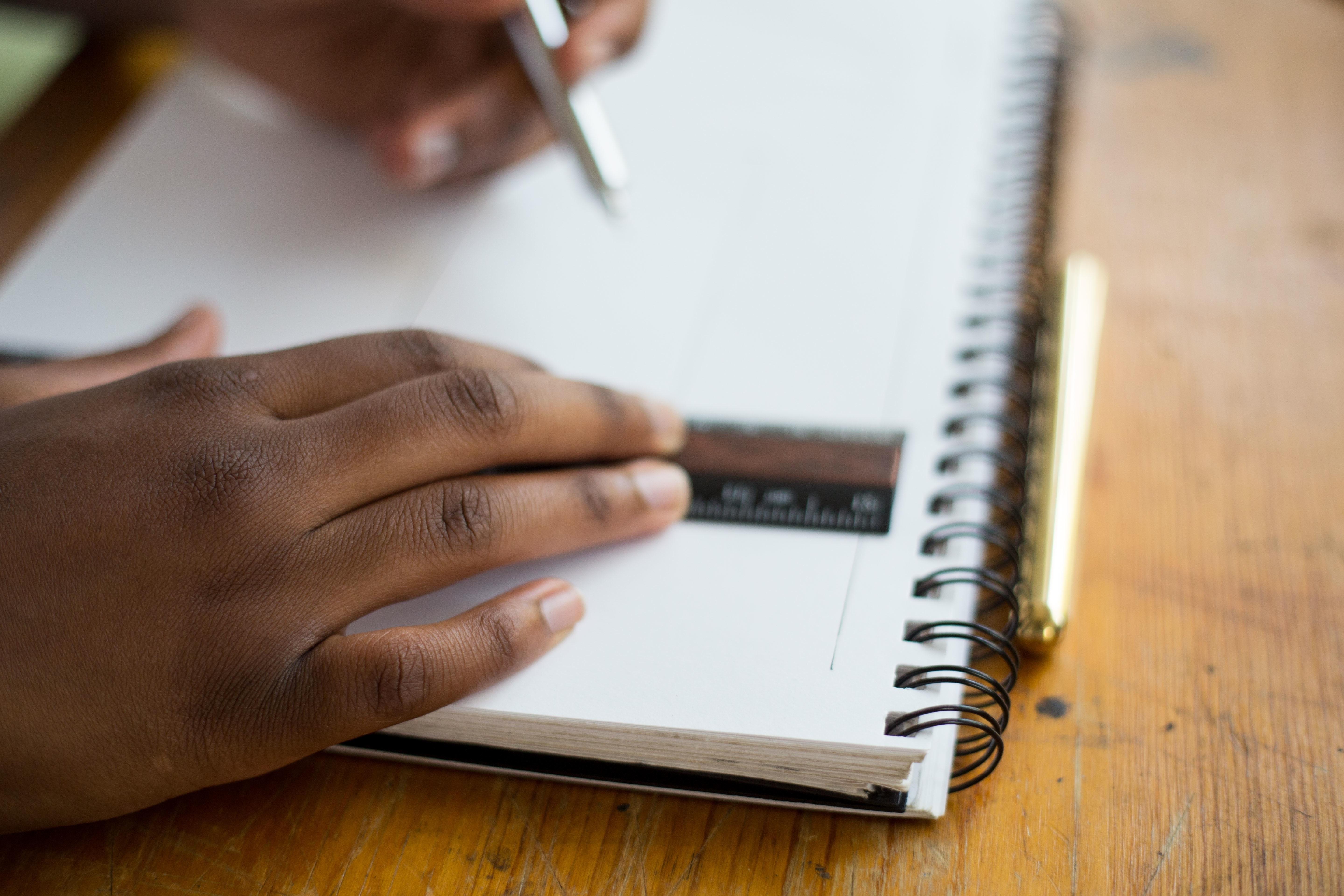 architectural-hands-with-notebook